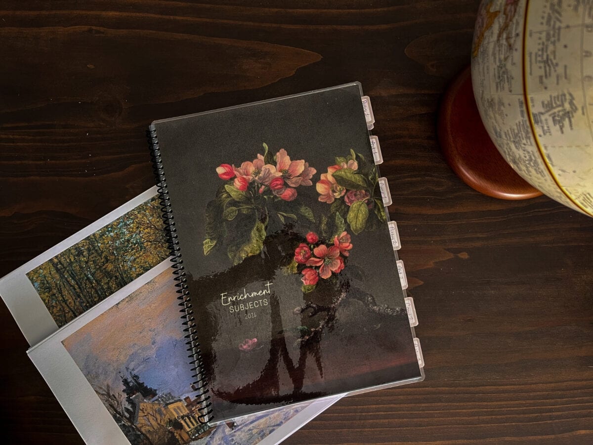 Homeschool enrichment subjects planner with floral cover and photos of nature and architecture.