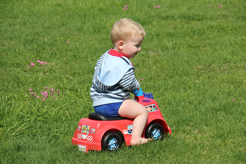 2 year old toddler riding a bike