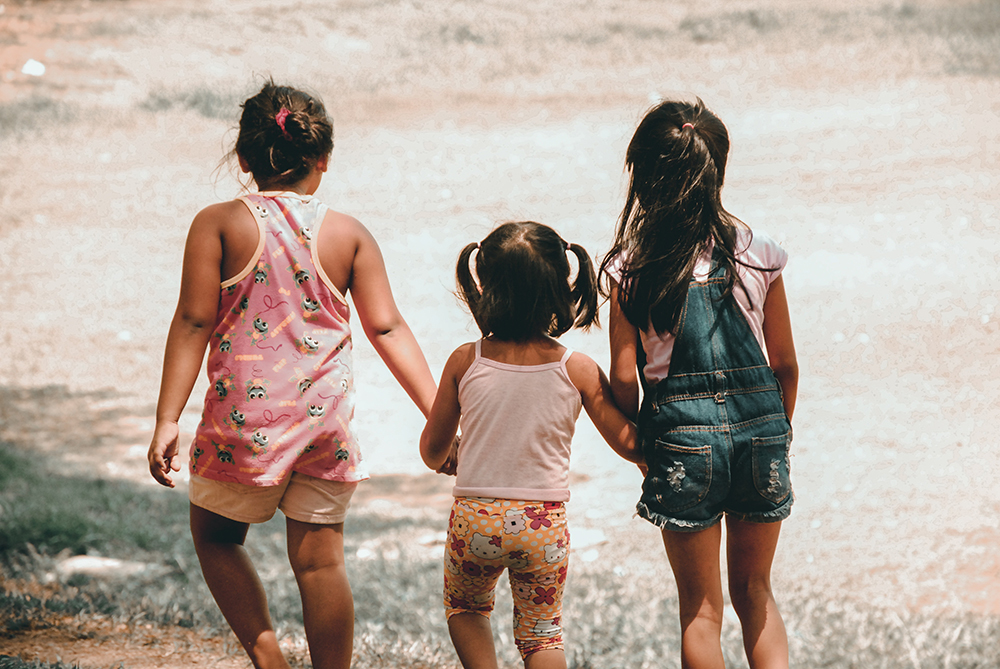 Girls holding hands