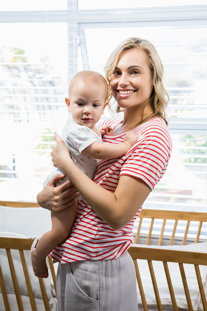mom holding baby